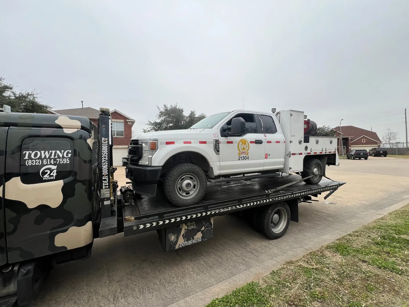 Fire department utility truck on flatbed tow truck in Houston TX